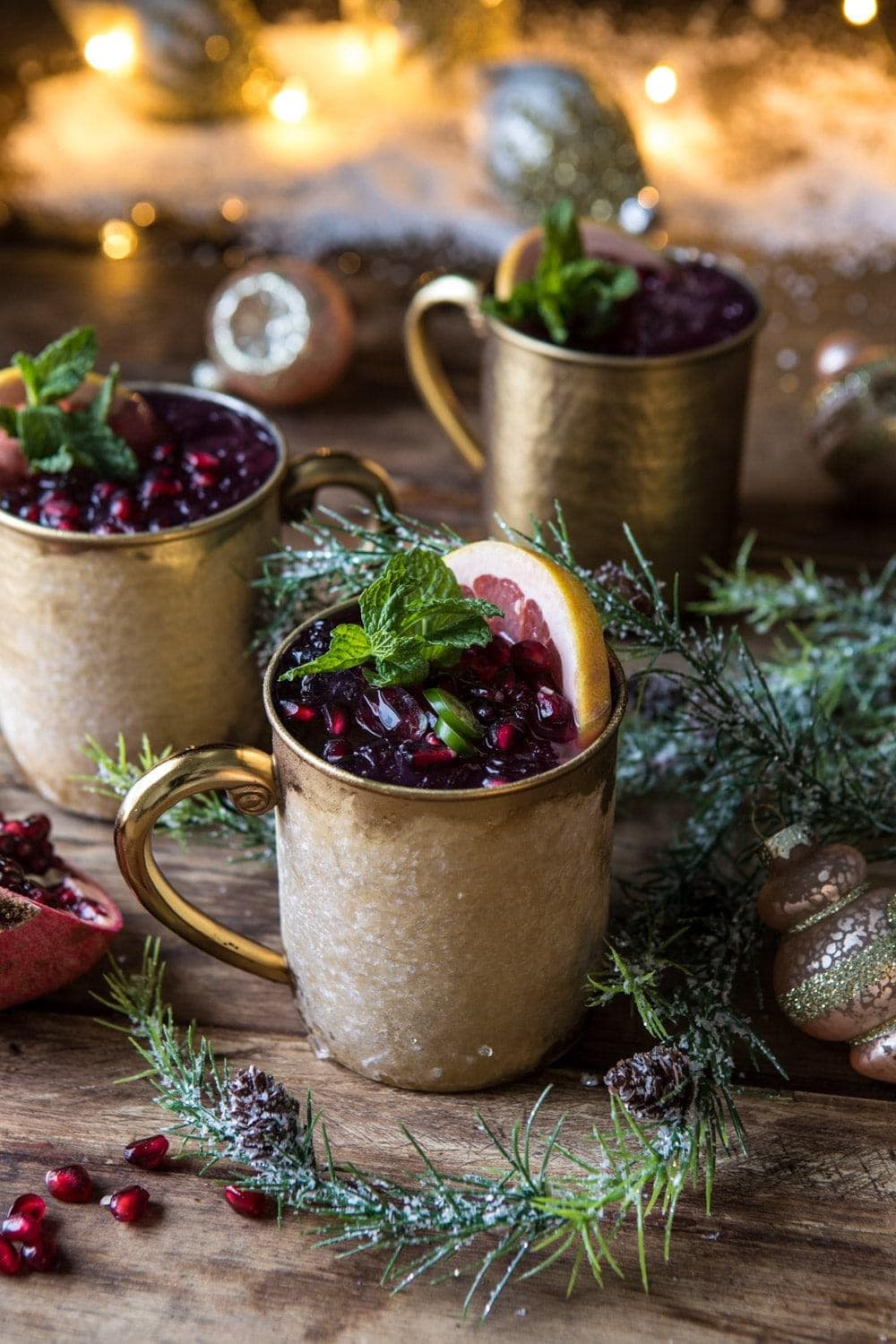 christmas-moscow-mule Moscow mules loaded with cranberries, ice and lemon slice.