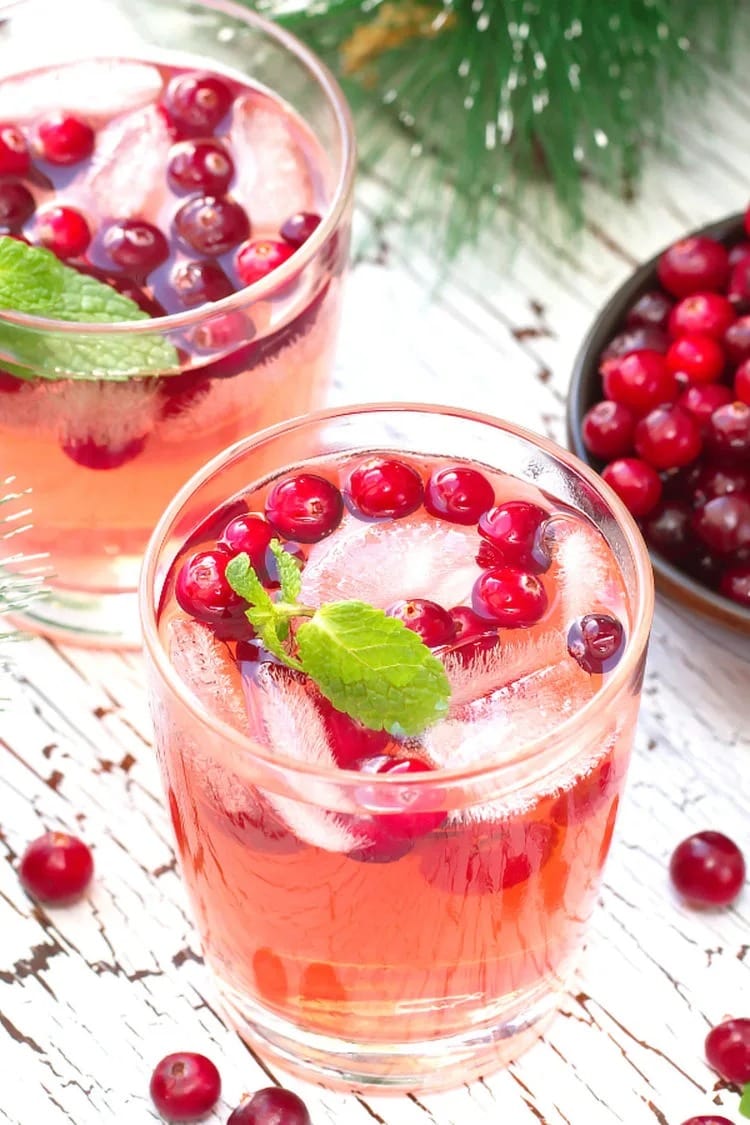 mistletoe-martini-cranberry-christmas-cocktail Iced martini served with cranberries.