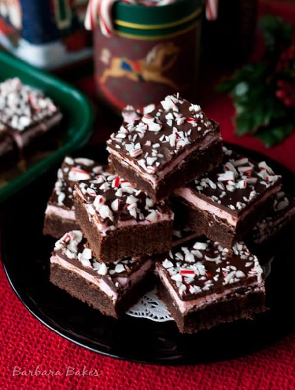 peppermint-candy-cane-brownies A stack of peppermint candy cane brownies garnished with crushed candies.