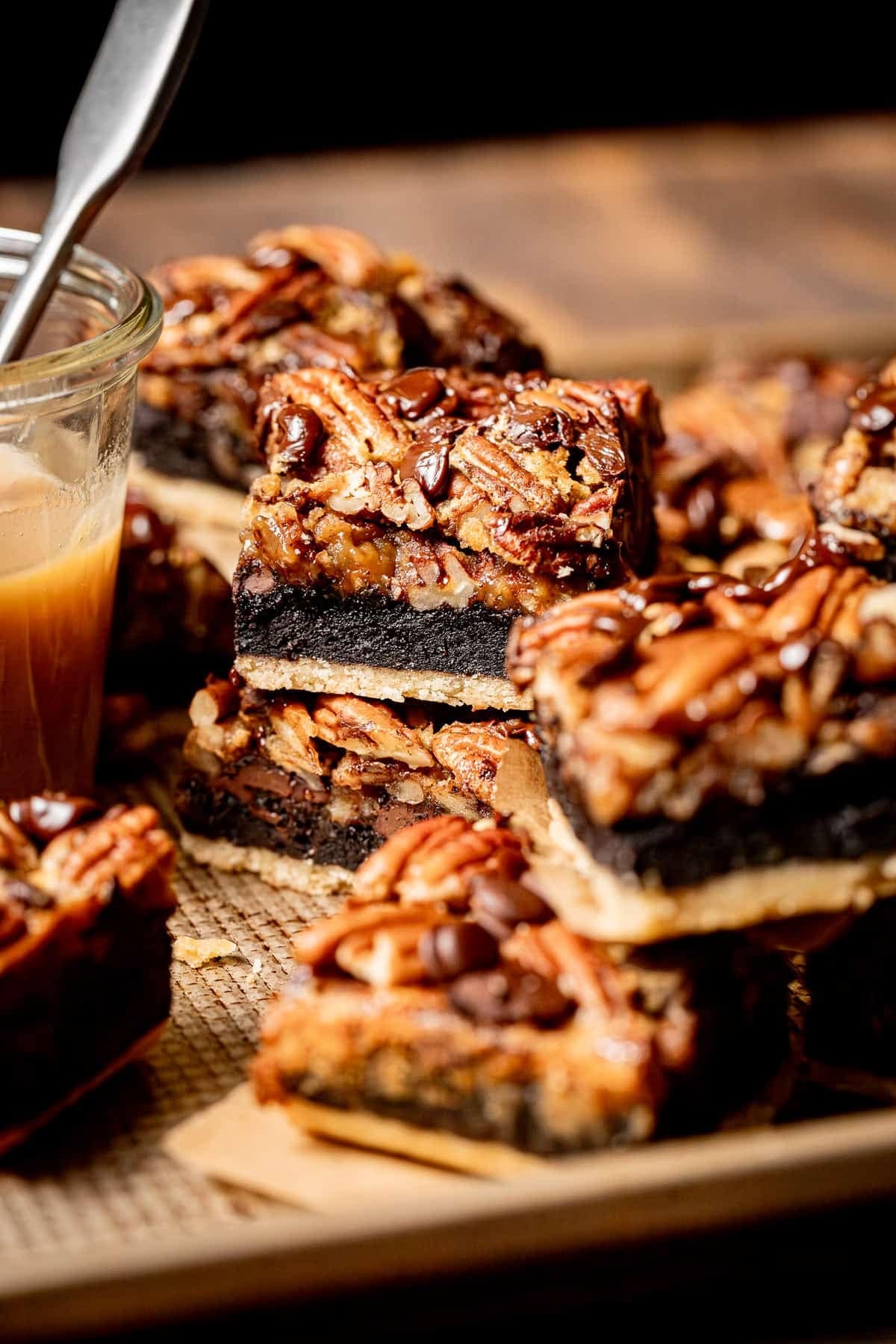 turtle-pecan-pie-brownies Brownies made with buttery shortbread crust, gooey brownie, and plenty of pecan on top.