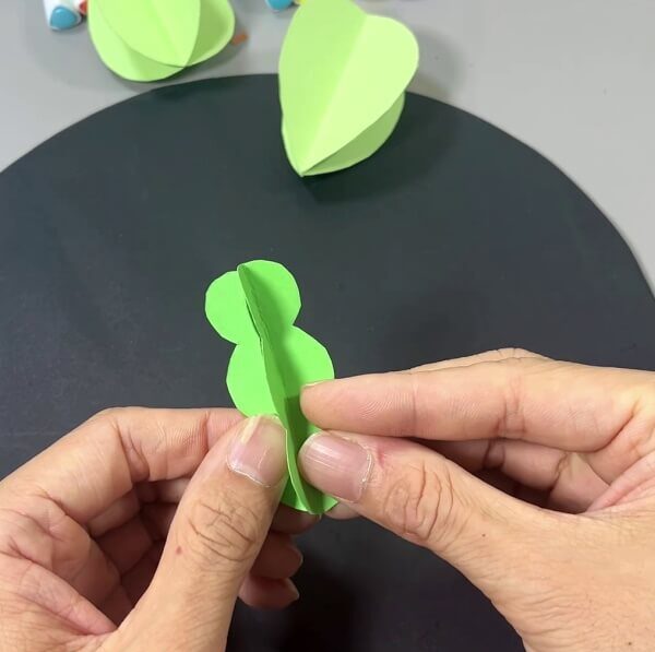 Pasting Green Paper To Make Leaves - Crafting paper cacti with the little ones.