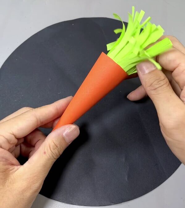 Inserting Leaves In Cone - How to Create a Paper Carrot With Clear Directions
