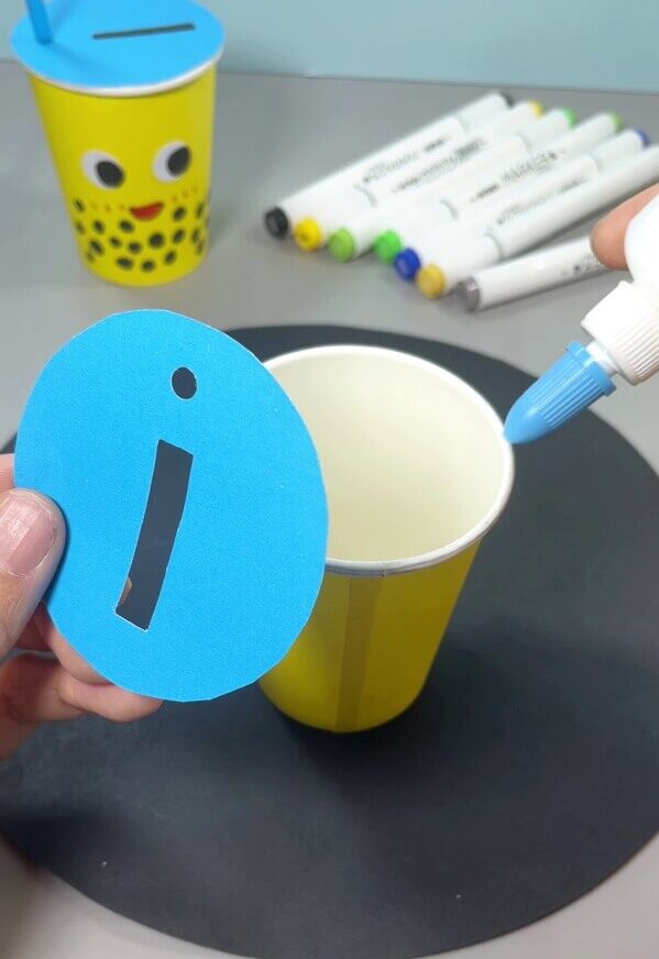 Applying Glue On the Top Edge Of the Paper Cup - Design and build useable thing with this effortless craft.