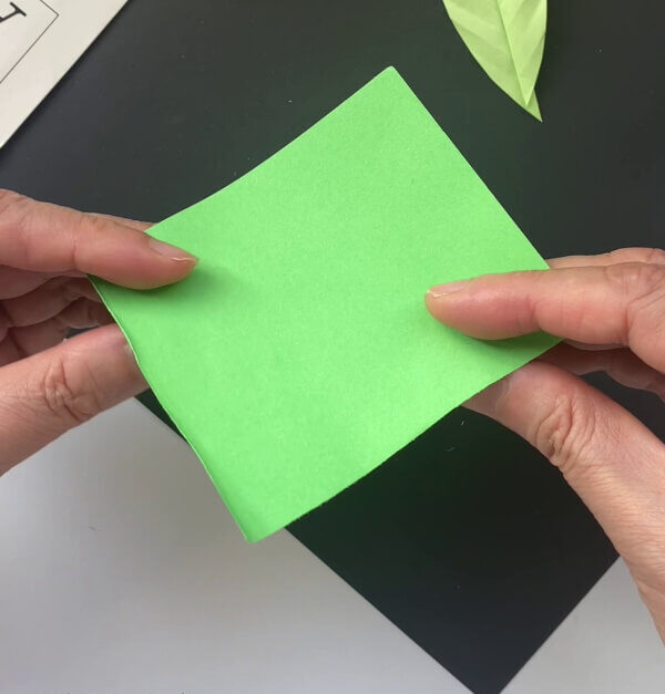 Getting A Square Green Paper A comprehensive guide on how to create a paper leaf for children