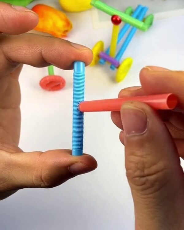 Make The Handle- Follow this step-by-step tutorial to make a scooter with plastic straws for kids