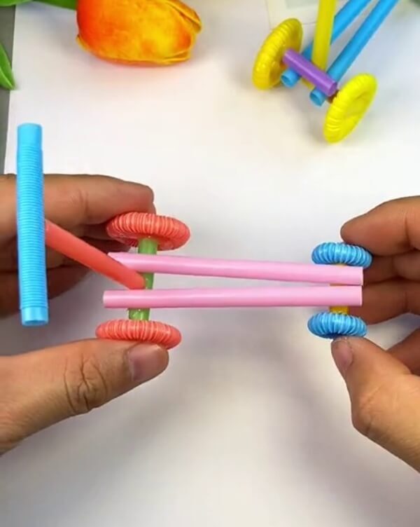 Back Wheels Connected-Here's how to build a kid's scooter with plastic straws - step-by-step instructions