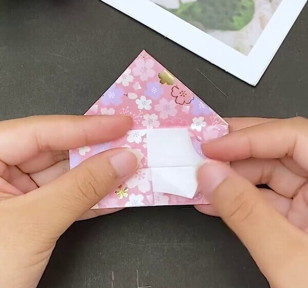 Make Folds On This Vertical Shape- Learn how to make a heart-shaped origami envelope with this tutorial