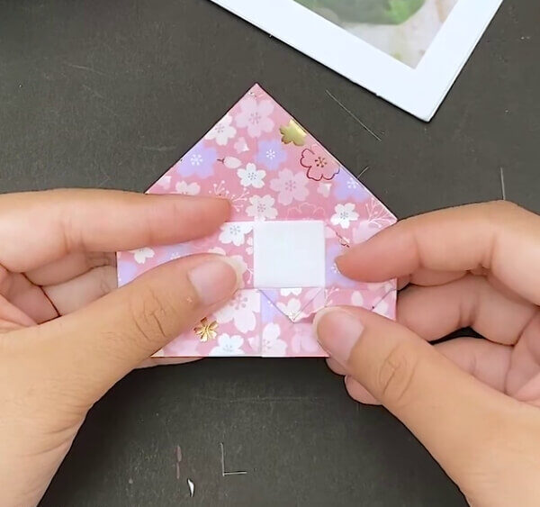 Make A Tiny Triangle On This Fold- This guide will explain how to fashion an Origami Heart Envelope in stages.