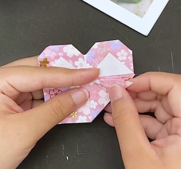 Align The Two Triangles- Learn how to make an Origami Heart Envelope with this step-by-step guide.