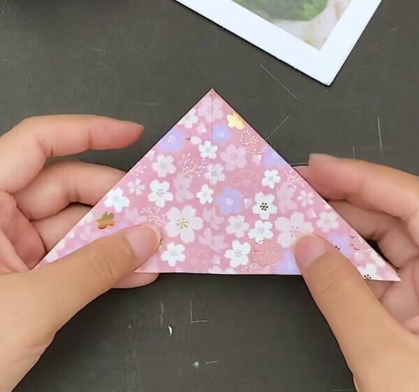 Connecting Both The Triangle Marks- Step-by-step guide to creating a paper heart envelope with origami