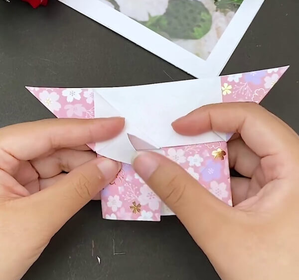 Repeating The Process Of The Other Side- Creating a heart-shaped envelope with origami instructions