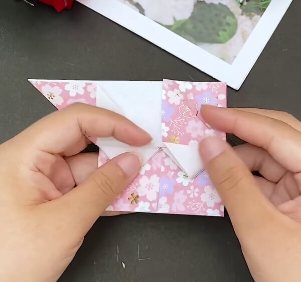 Make Folds On the Top Section As Well- Step-by-step instructions to build a heart-shaped envelope with origami