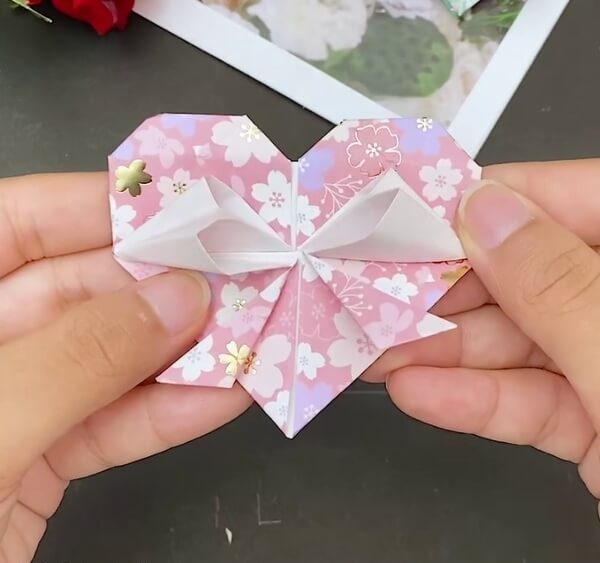 Your Craft Is Ready- Detailed instructions on how to create an Origami Heart Envelope are provided here.