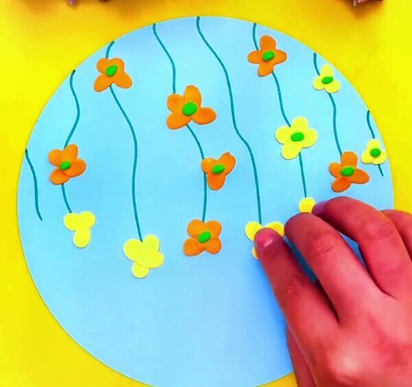Shape The Clay Into The Shape Of Flowers-Helping young ones to shape clay butterflies and flowers