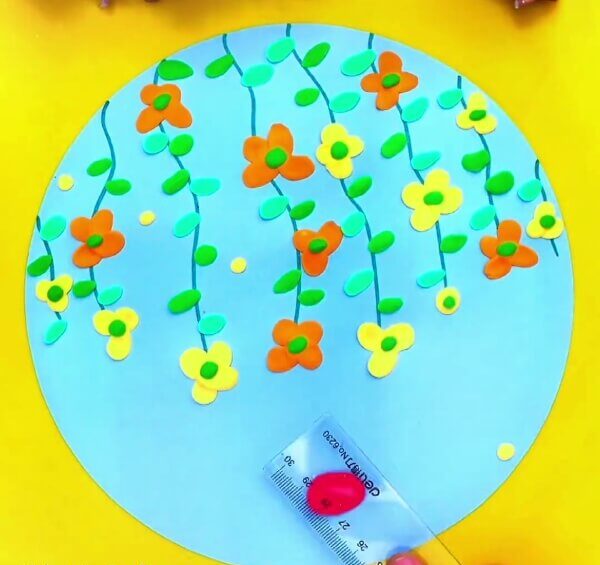 Make A Butterfly With Red Modelling Clay-Assist kids in fabricating clay butterflies and blooms