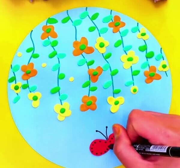 Make Details Of The Butterfly With A Black Sketch Pen-Demonstrating to kids the steps of forming clay butterflies and petals